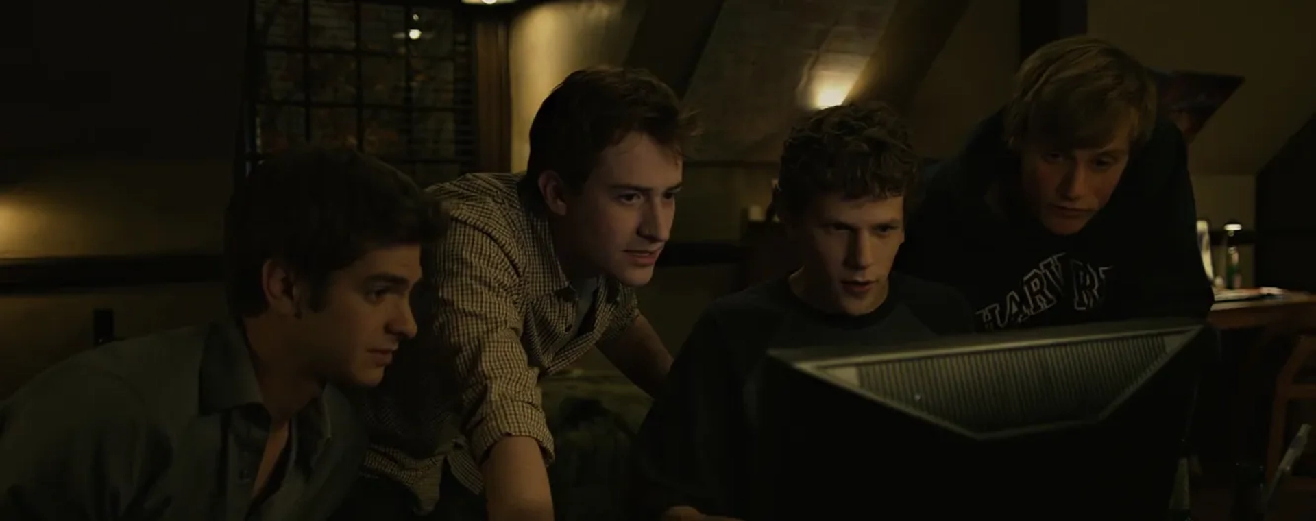 Joseph Mazzello, Jesse Eisenberg, and Andrew Garfield in The Social Network (2010)