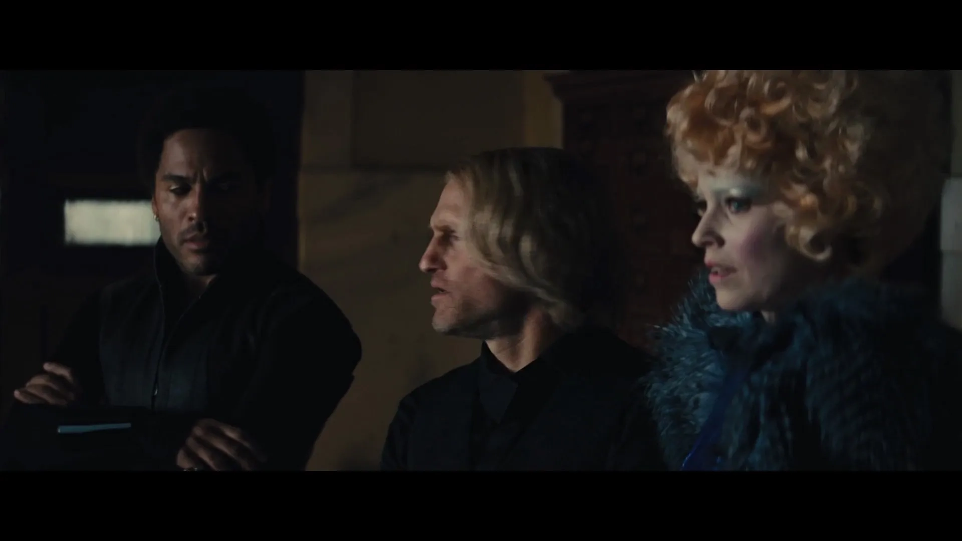 Woody Harrelson, Lenny Kravitz, and Elizabeth Banks in The Hunger Games: Catching Fire (2013)