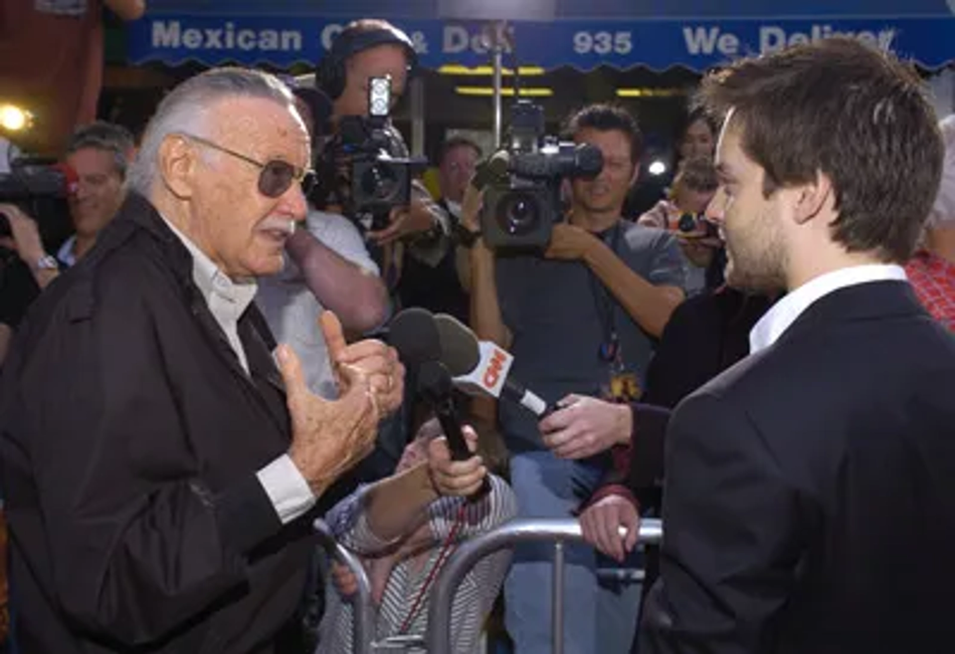 Tobey Maguire and Stan Lee at an event for Spider-Man 2 (2004)