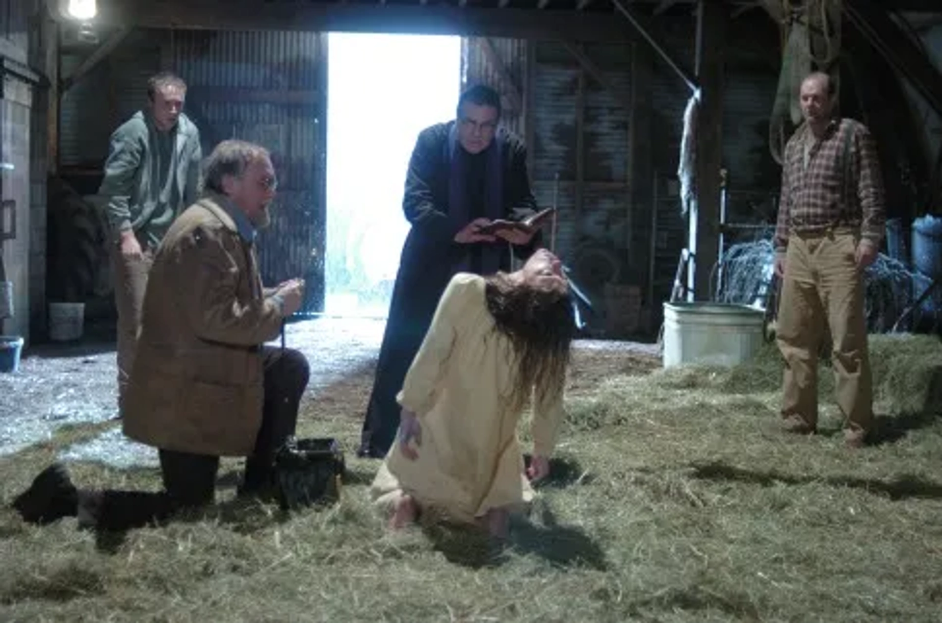 Kenneth Welsh, Andrew Wheeler, Tom Wilkinson, Joshua Close, and Jennifer Carpenter in The Exorcism of Emily Rose (2005)