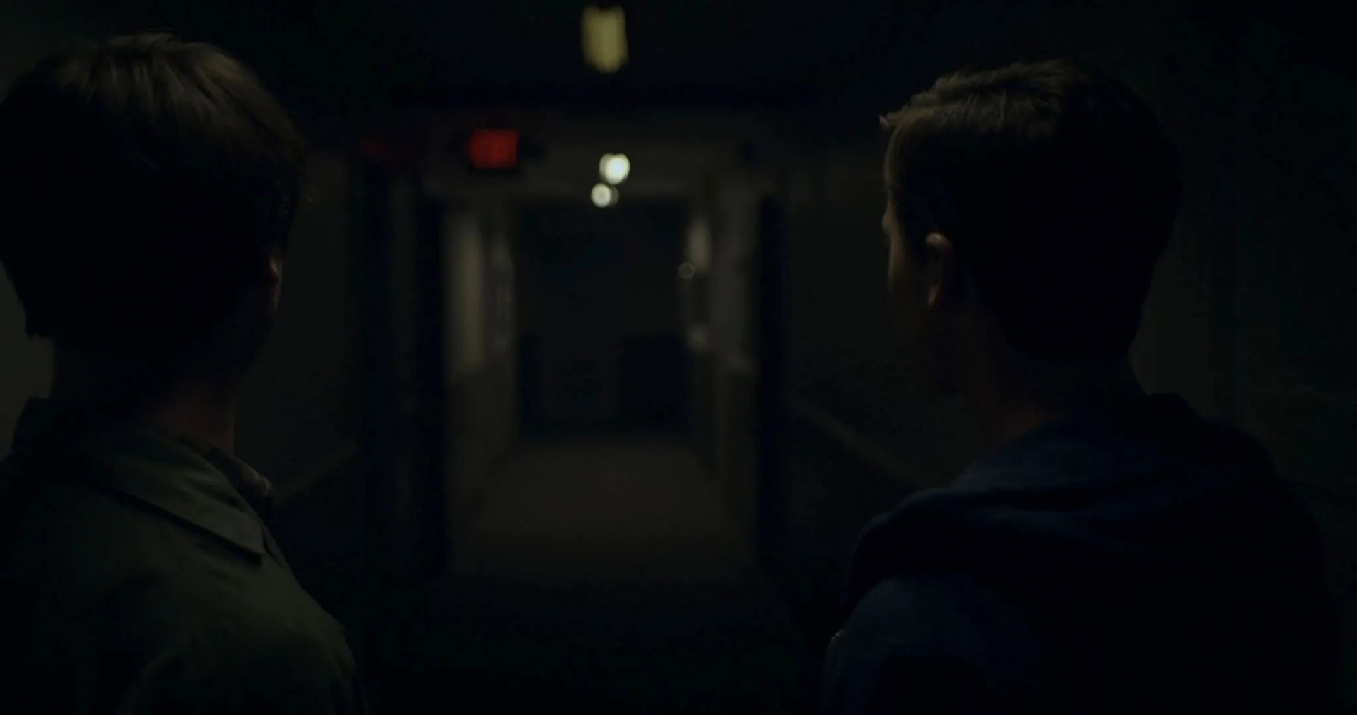 Calum Worthy and Joel Courtney in Assimilate (2019)