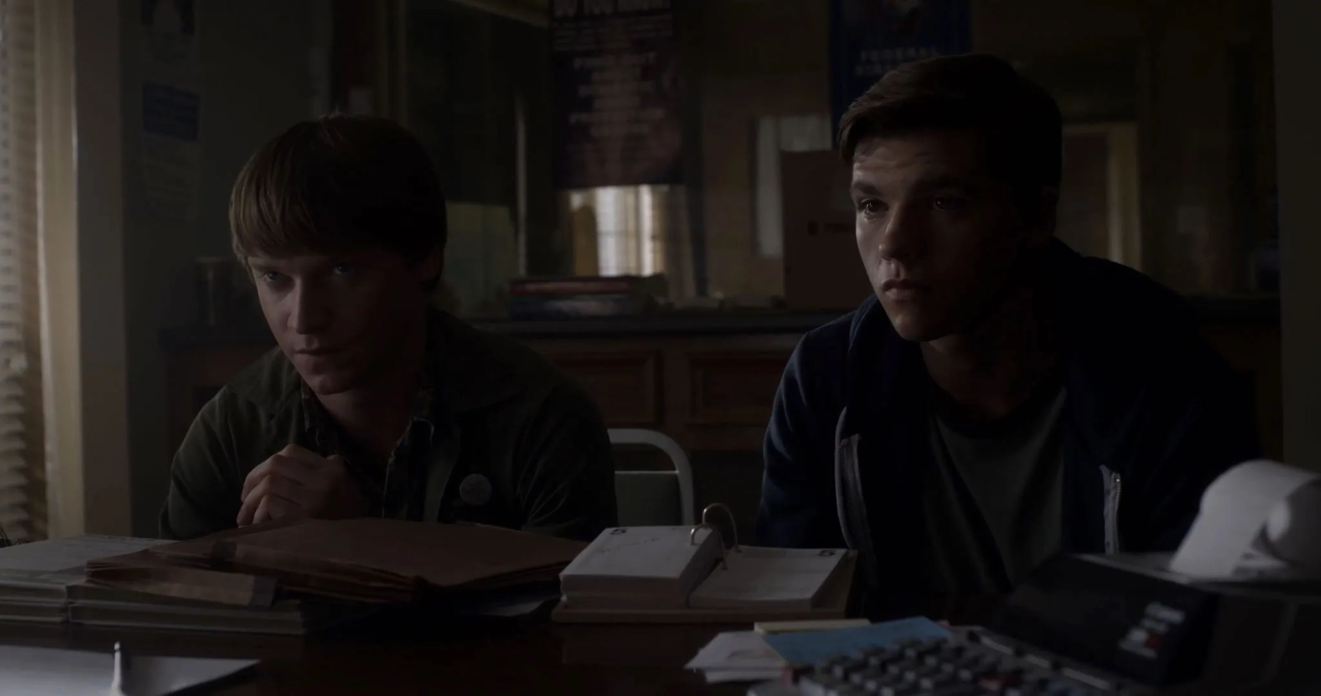 Calum Worthy and Joel Courtney in Assimilate (2019)