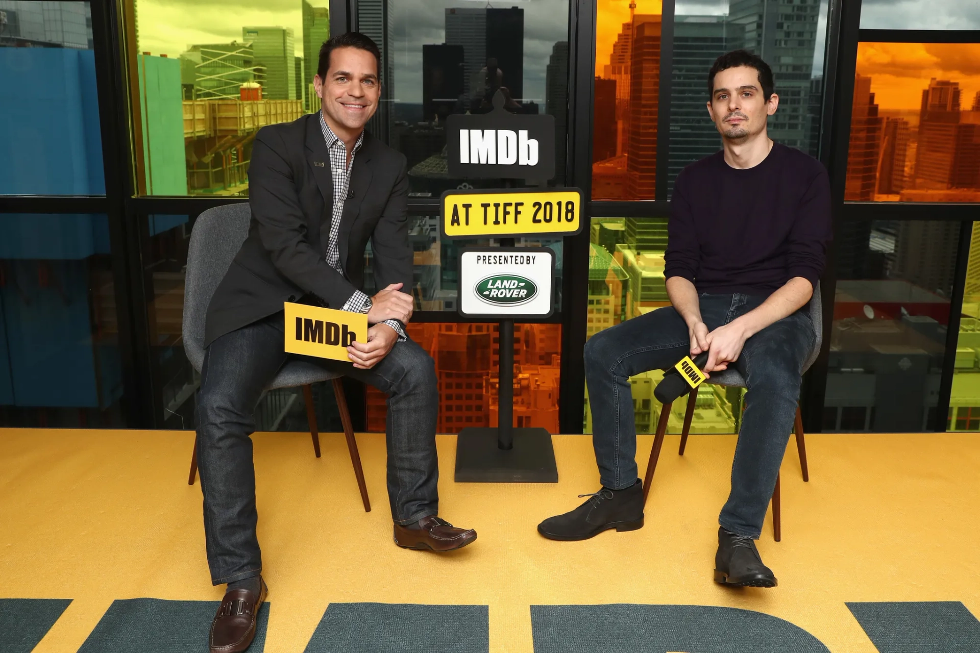 Dave Karger and Damien Chazelle at an event for First Man (2018)