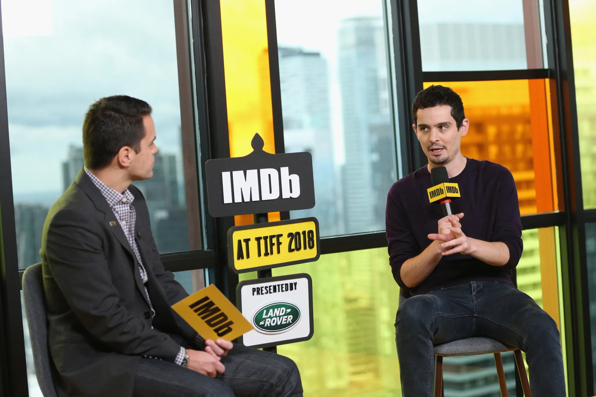 Dave Karger and Damien Chazelle at an event for First Man (2018)