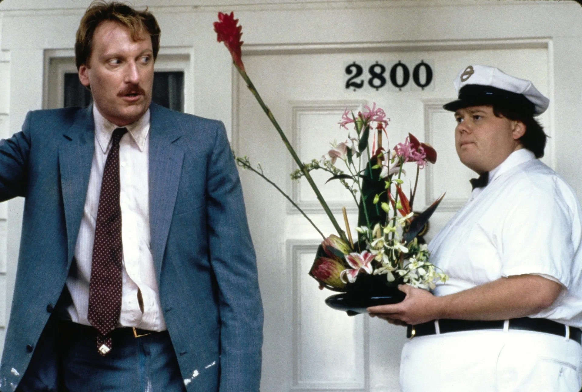 Jeffrey Jones and Louie Anderson in Ferris Bueller's Day Off (1986)