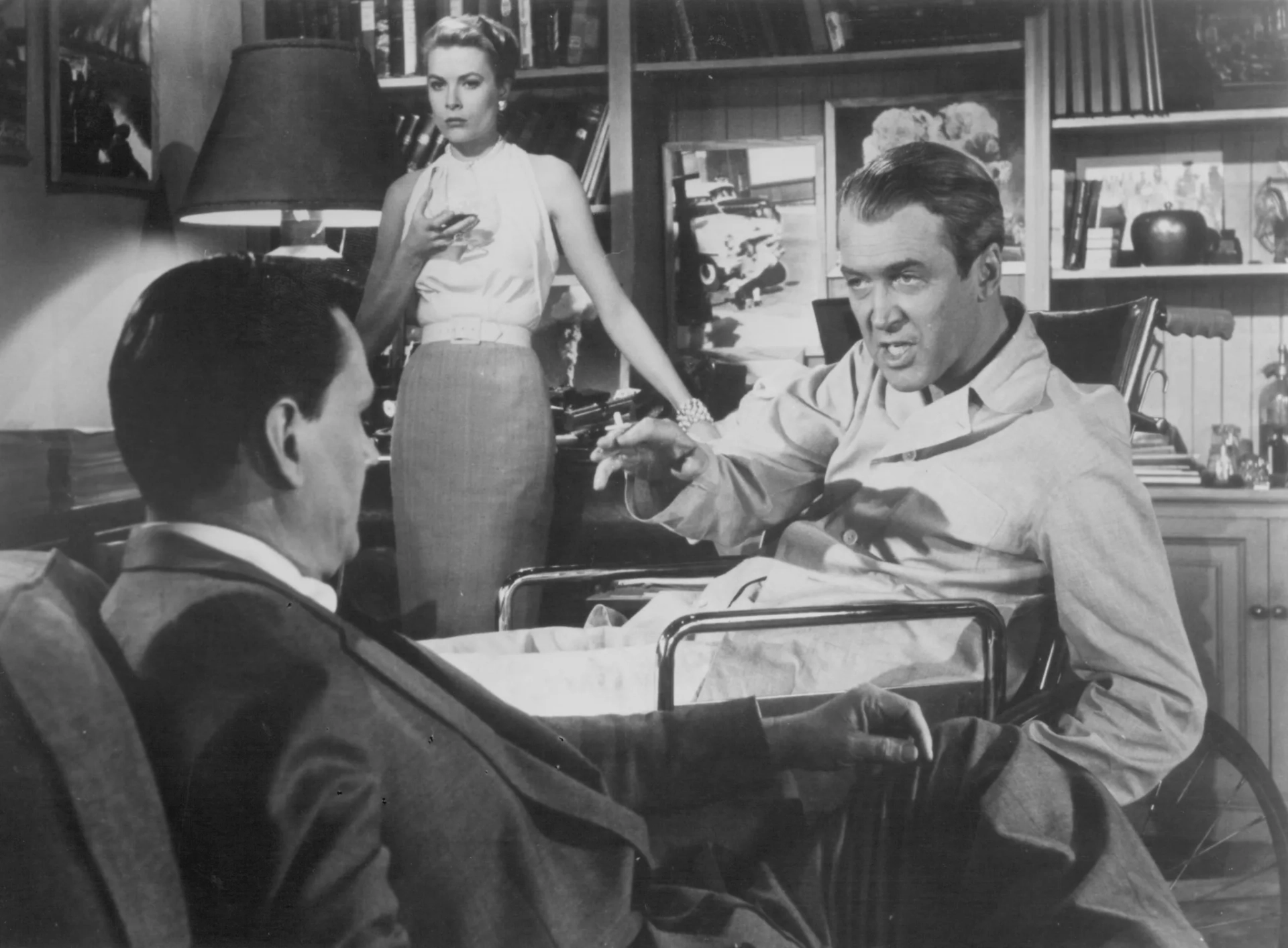 Grace Kelly, James Stewart, and Wendell Corey in Rear Window (1954)