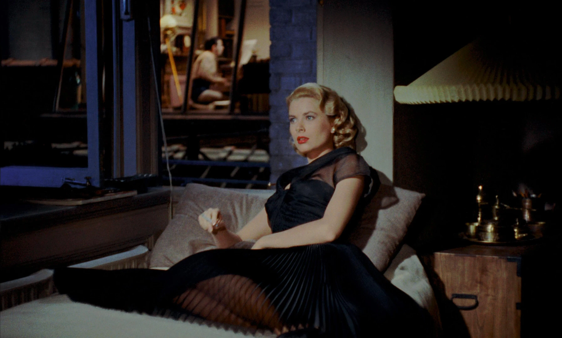 Grace Kelly and Ross Bagdasarian in Rear Window (1954)