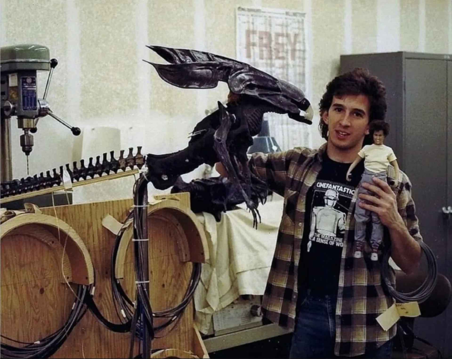 Tony Gardner sizes up the animatronic Alien Queen and Sigourney Weaver puppets at Doug Beswick Studios while the puppets were under construction for James Cameron's "Aliens."