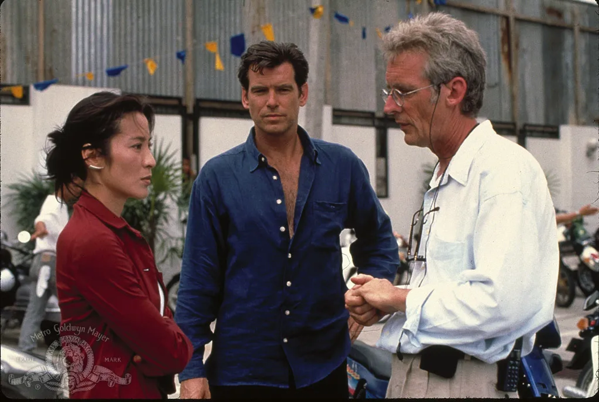 Pierce Brosnan, Michelle Yeoh, and Roger Spottiswoode in Tomorrow Never Dies (1997)