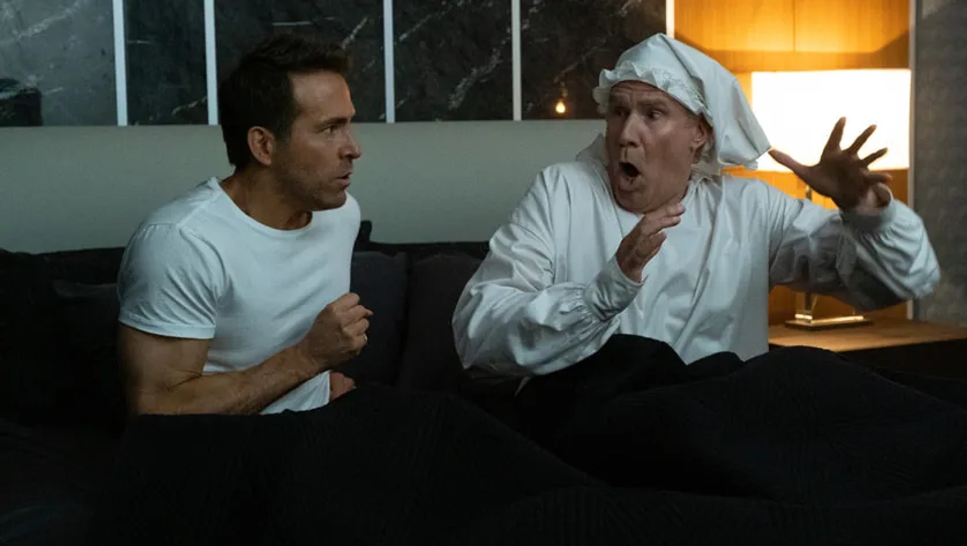 Will Ferrell and Ryan Reynolds in Spirited (2022)