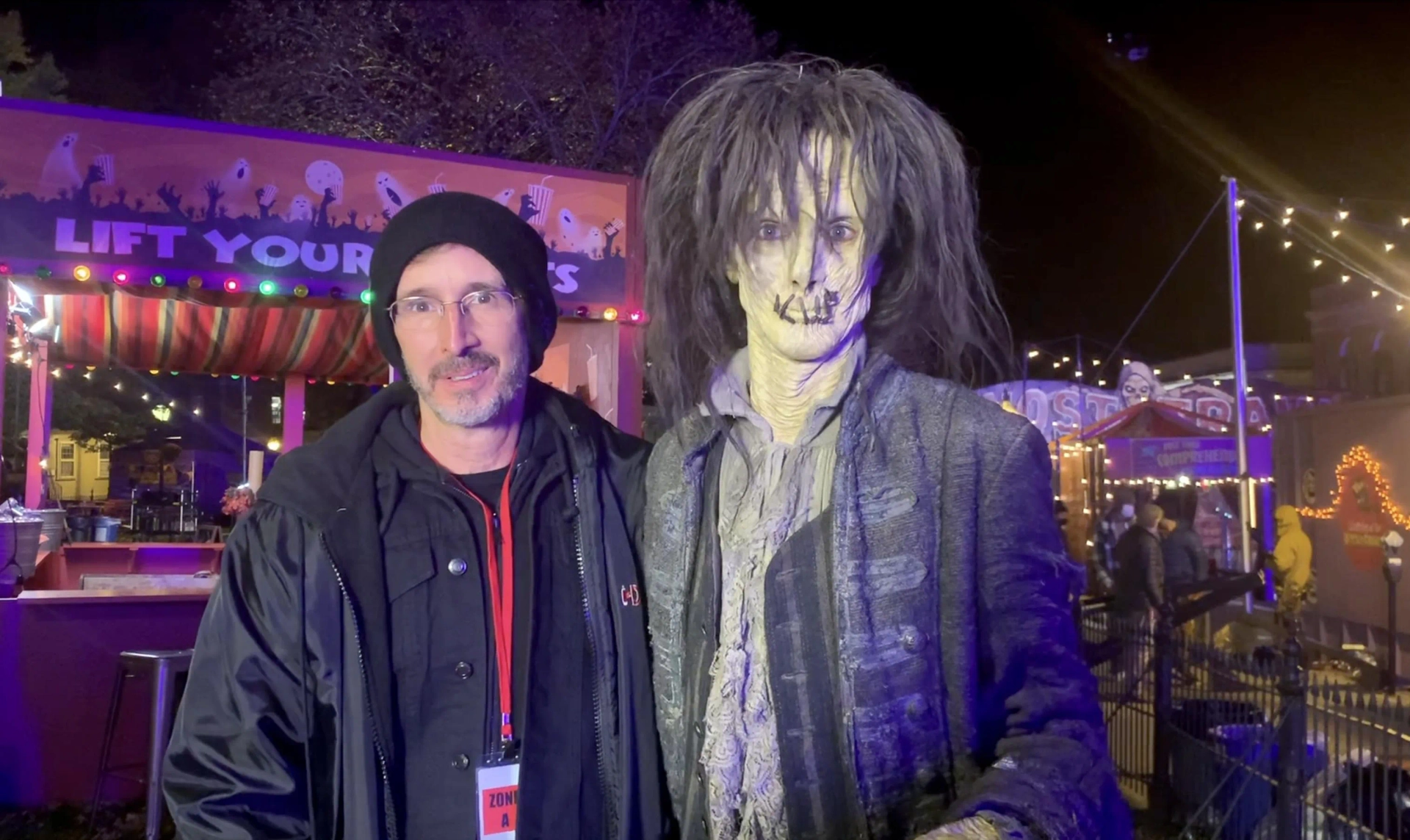 "Hocus Pocus 2" Behind the Scenes: Makeup Effects Designer Tony Gardner on the outdoor carnival set with actor Doug Jones in prosthetic makeup and wardrobe as Billy Butcherson.