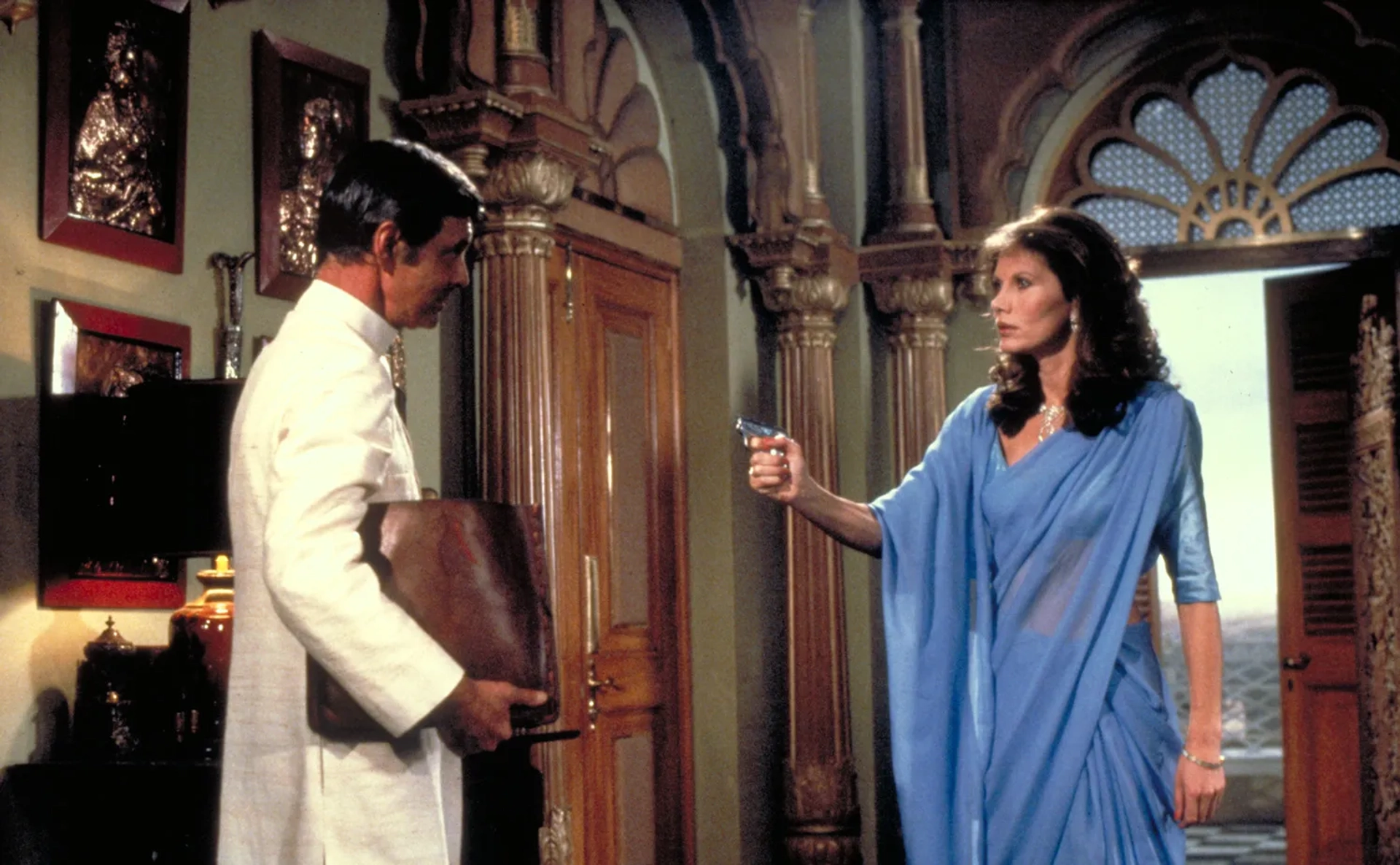 Maud Adams and Louis Jourdan in Octopussy (1983)