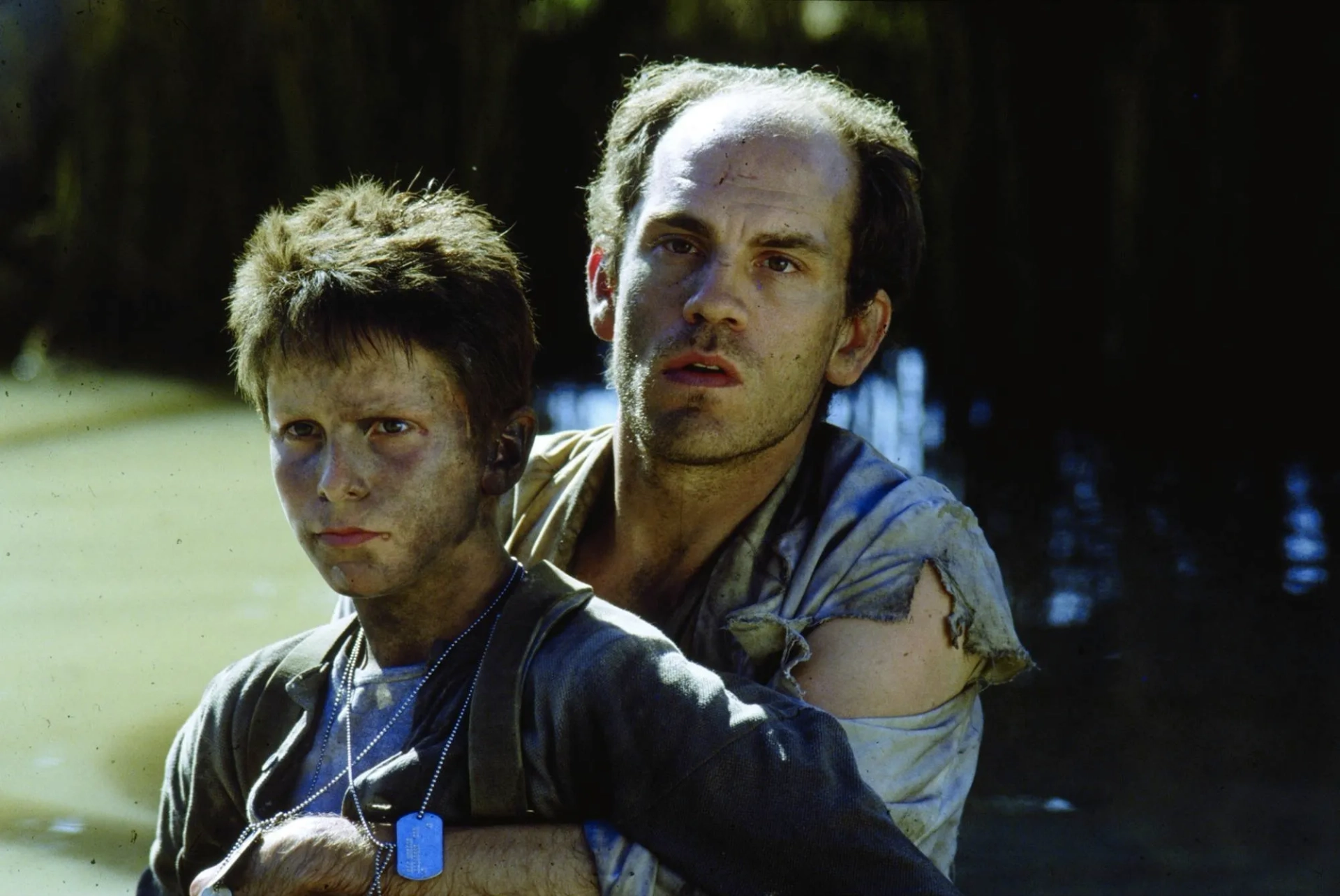 Christian Bale and John Malkovich in Empire of the Sun (1987)