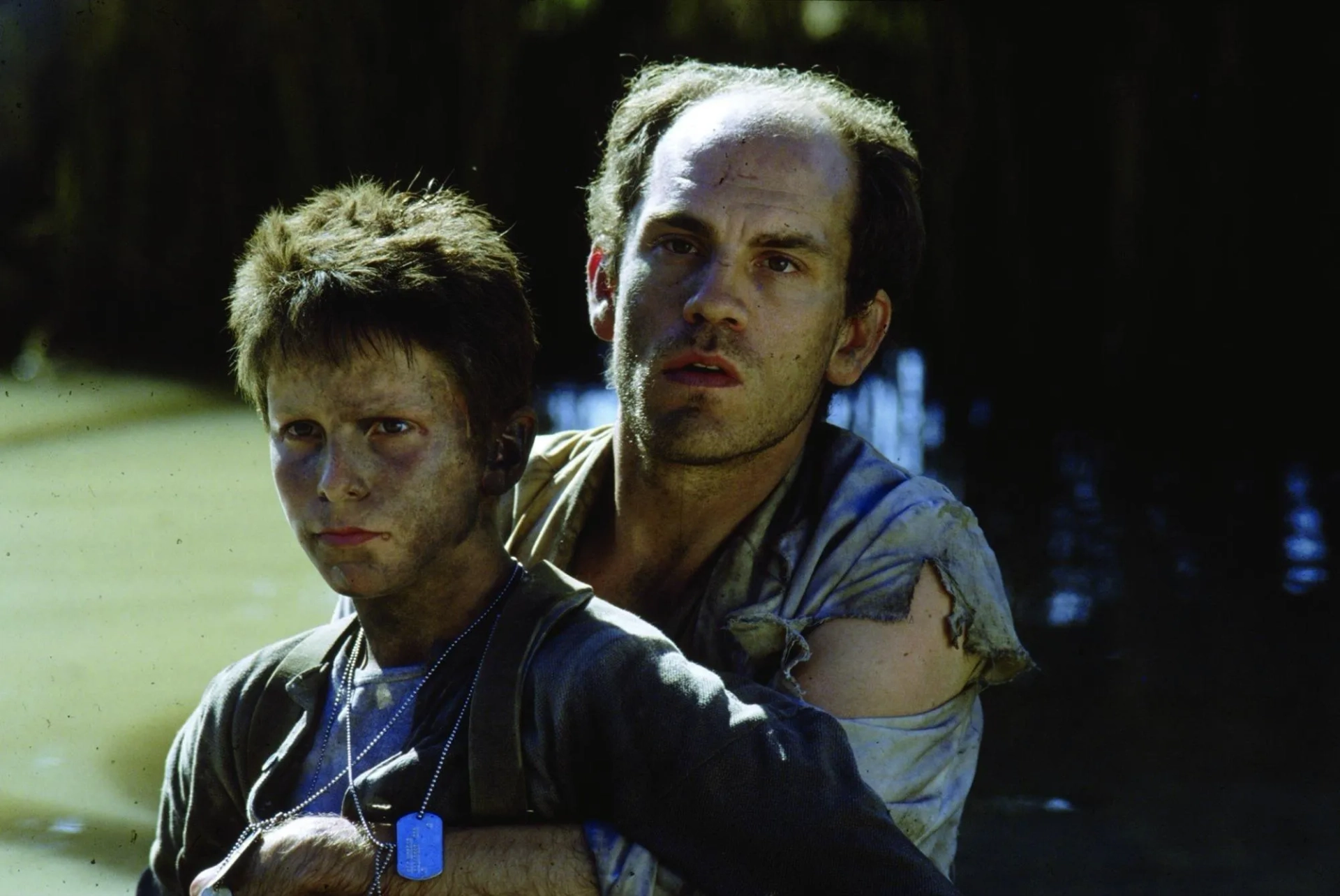 Christian Bale and John Malkovich in Empire of the Sun (1987)