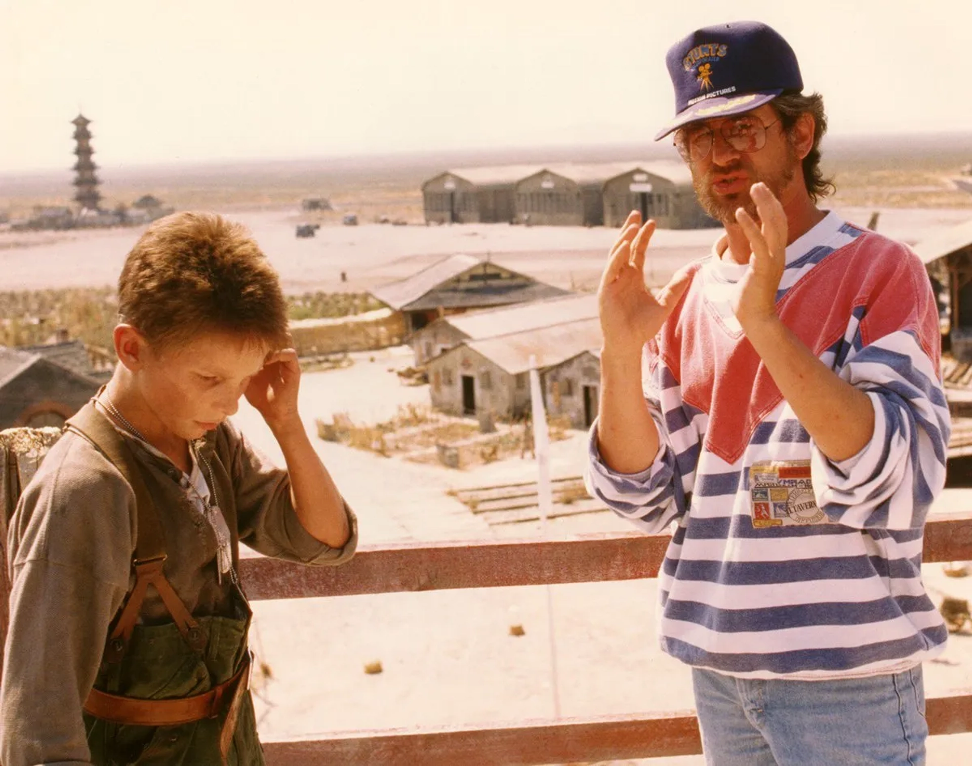 Steven Spielberg and Christian Bale in Empire of the Sun (1987)