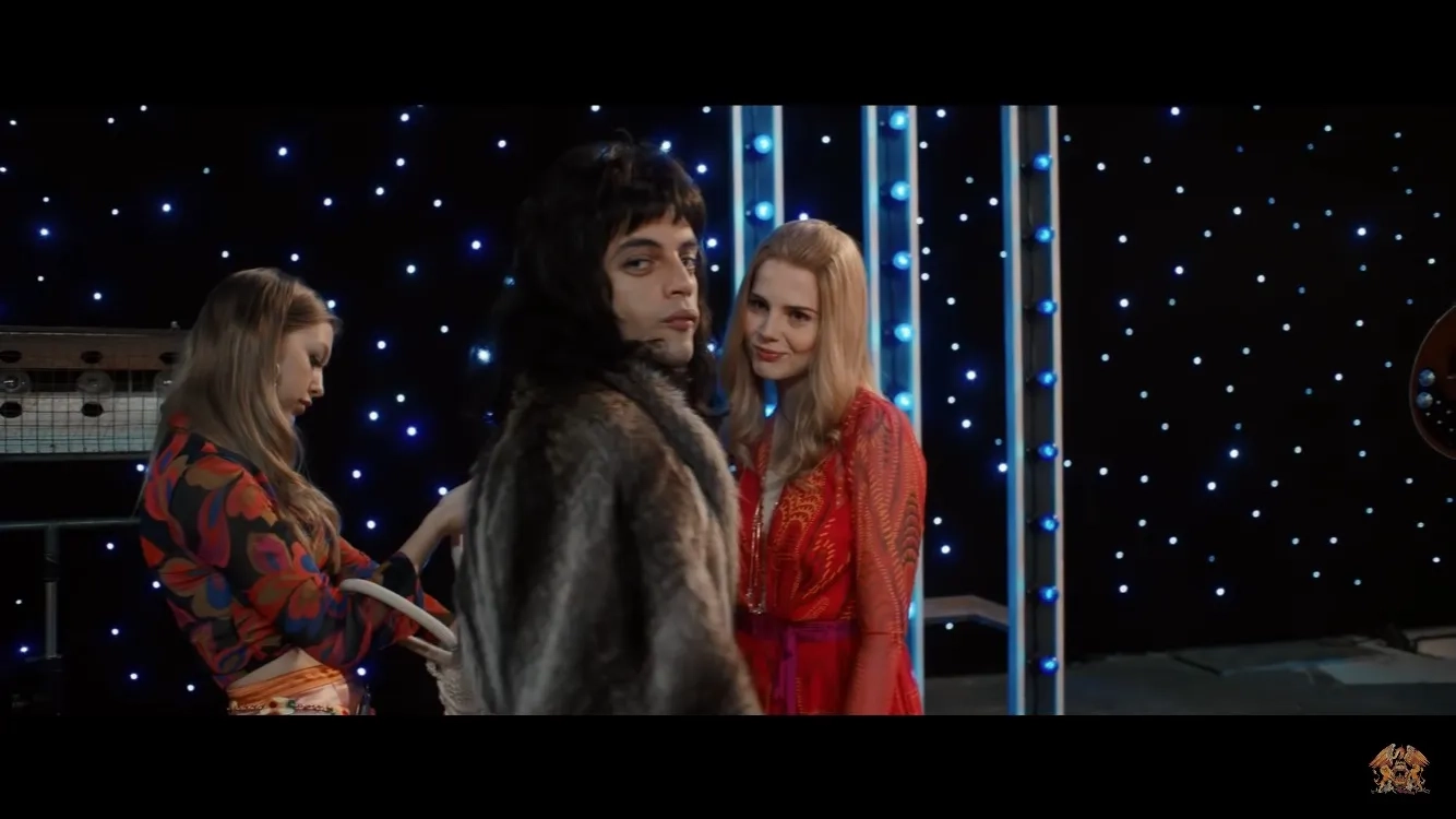 Rami Malek, Lucy Boynton, and Jess Radomska in Bohemian Rhapsody (2018)