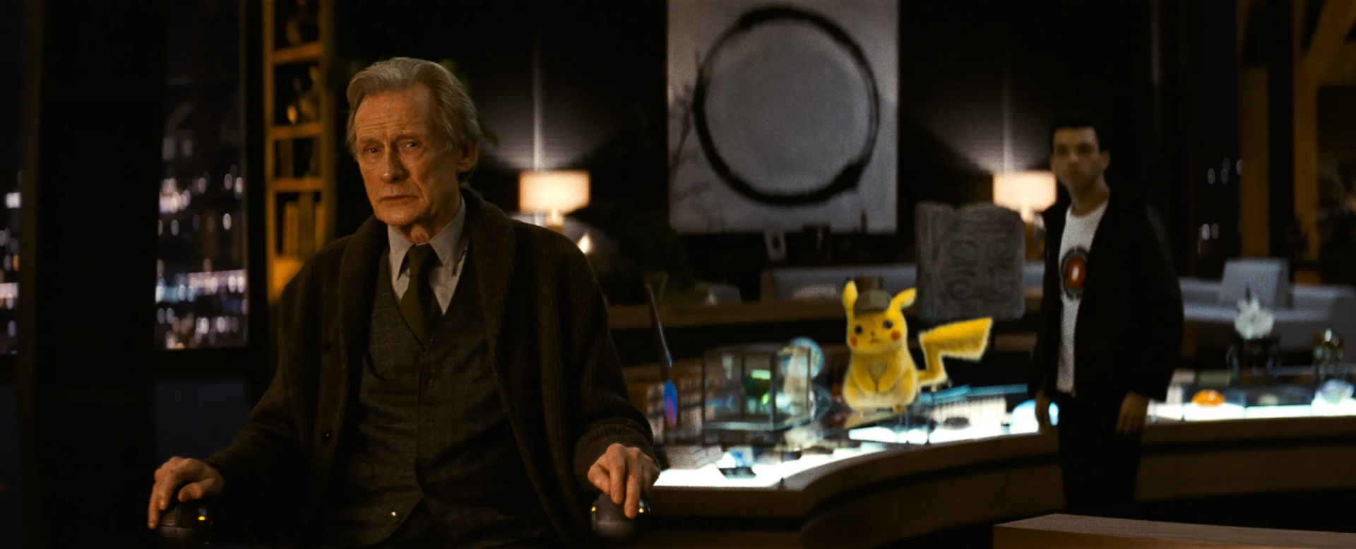 Ryan Reynolds, Bill Nighy, and Justice Smith in Pokémon: Detective Pikachu (2019)