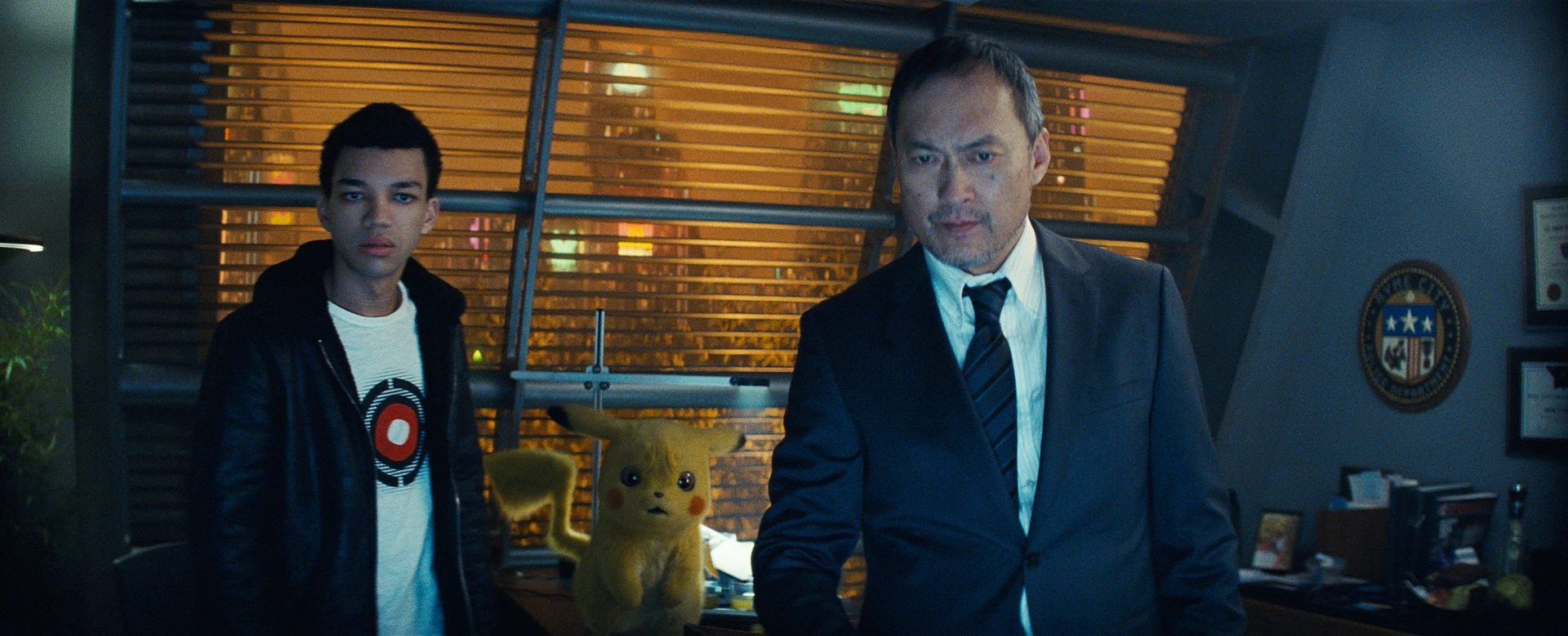 Ryan Reynolds, Ken Watanabe, and Justice Smith in Pokémon: Detective Pikachu (2019)