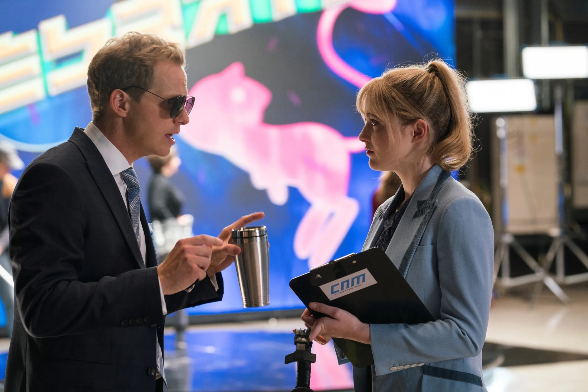 Still of Chris Geere and Kathryn Newton in Pokémon Detective Pikachu