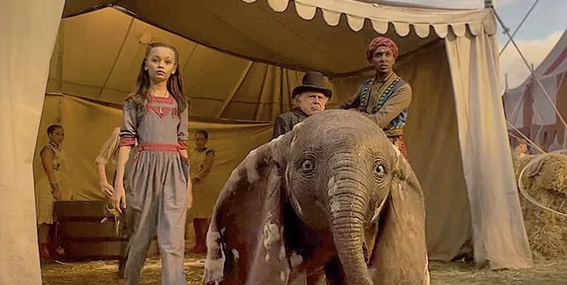 Danny DeVito, Ragevan Vasan, and Nico Parker in Dumbo (2019)