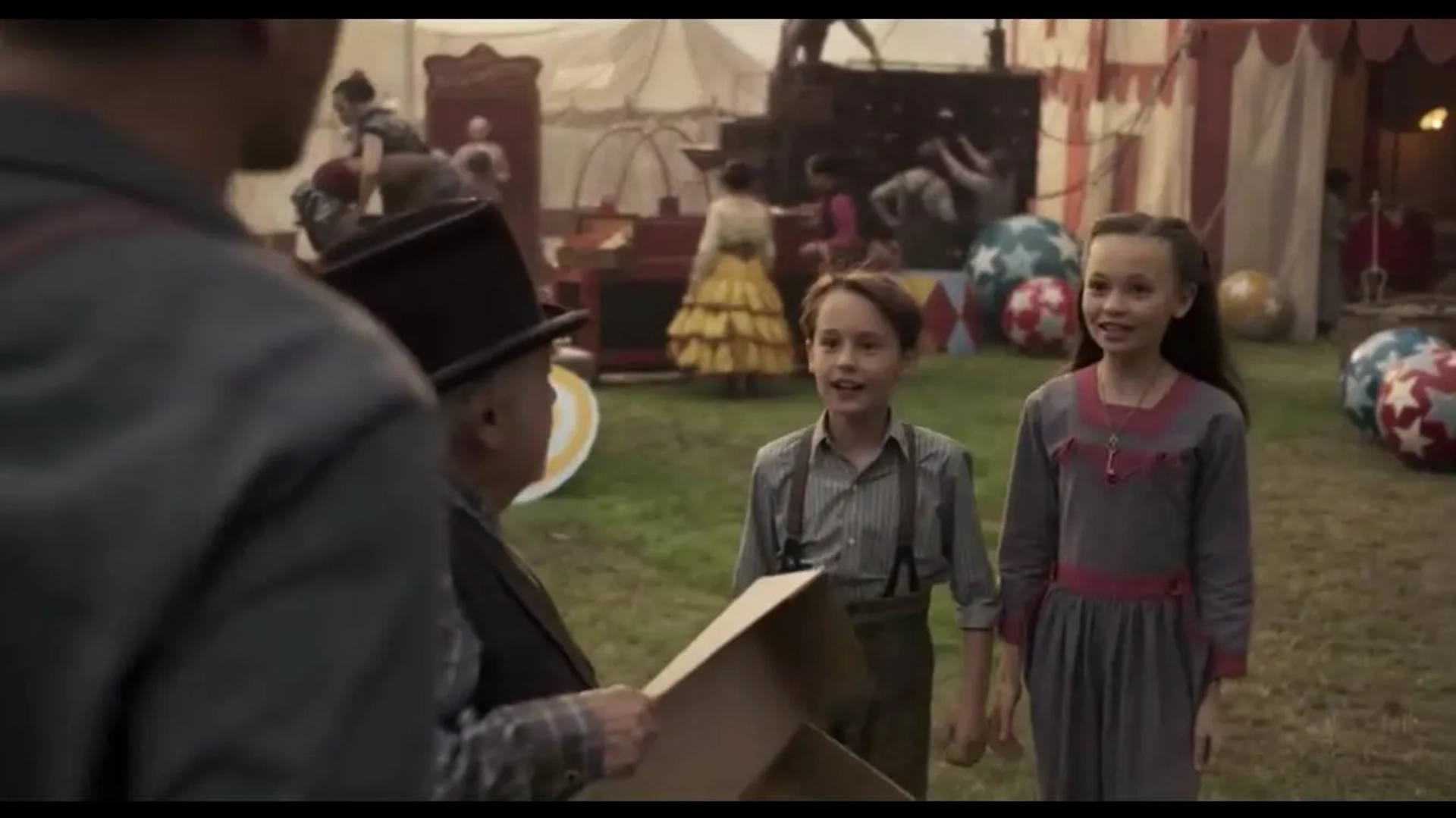 Danny DeVito, Finley Hobbins, and Nico Parker in Dumbo (2019)