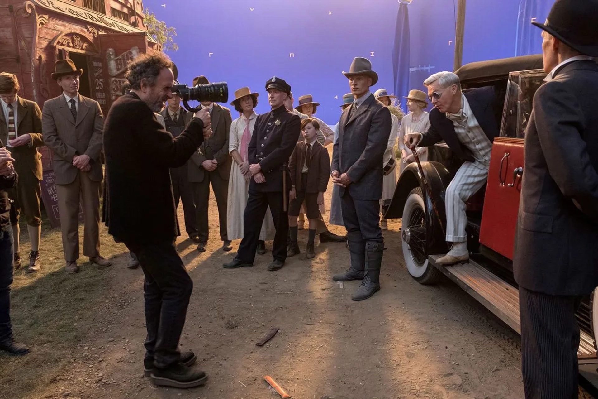 Still of Tim Burton, Joseph Gatt & Michael Keaton on the set of Dumbo.