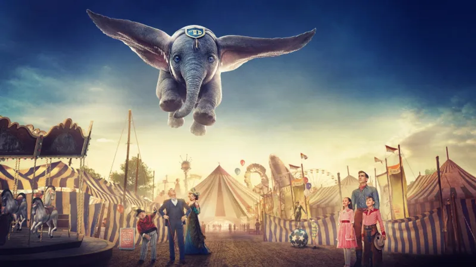 Danny DeVito, Michael Keaton, Colin Farrell, Eva Green, Finley Hobbins, and Nico Parker in Dumbo (2019)