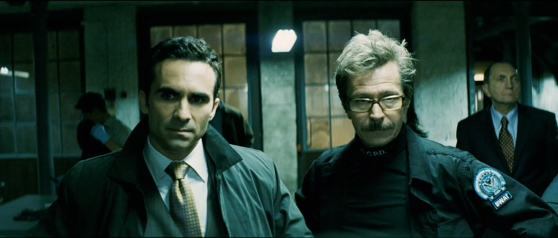 Gary Oldman and Nestor Carbonell in The Dark Knight (2008)