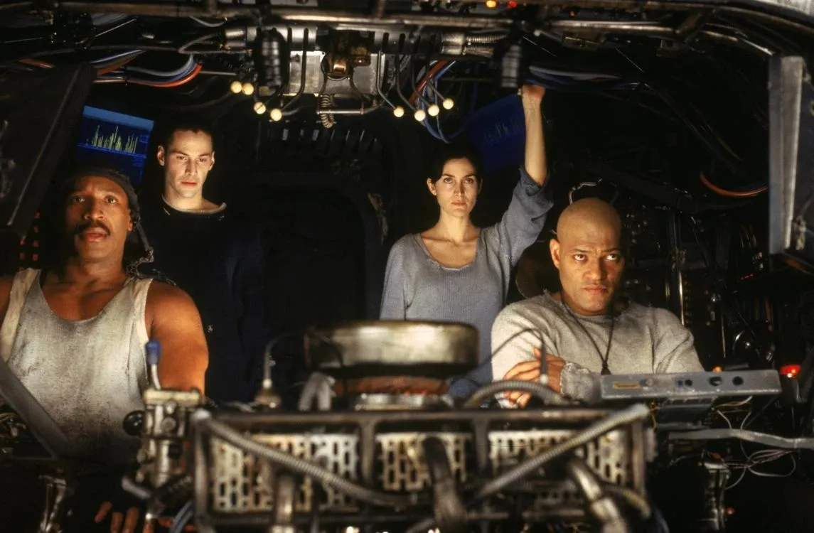 Keanu Reeves, Laurence Fishburne, Carrie-Anne Moss, and Anthony Ray Parker in The Matrix (1999)