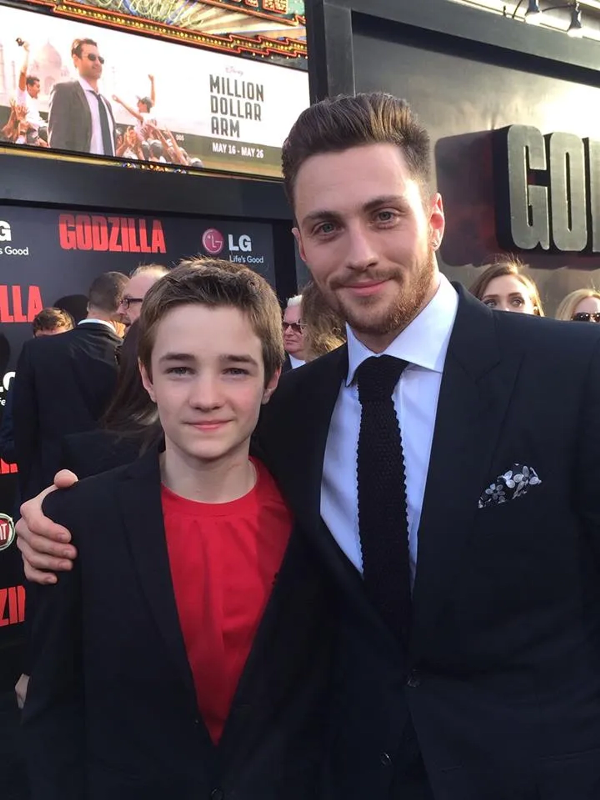 CJ Adams (Young Ford) and Aaron Taylor Johnson (Ford) at the premier of GODZILLA 2014