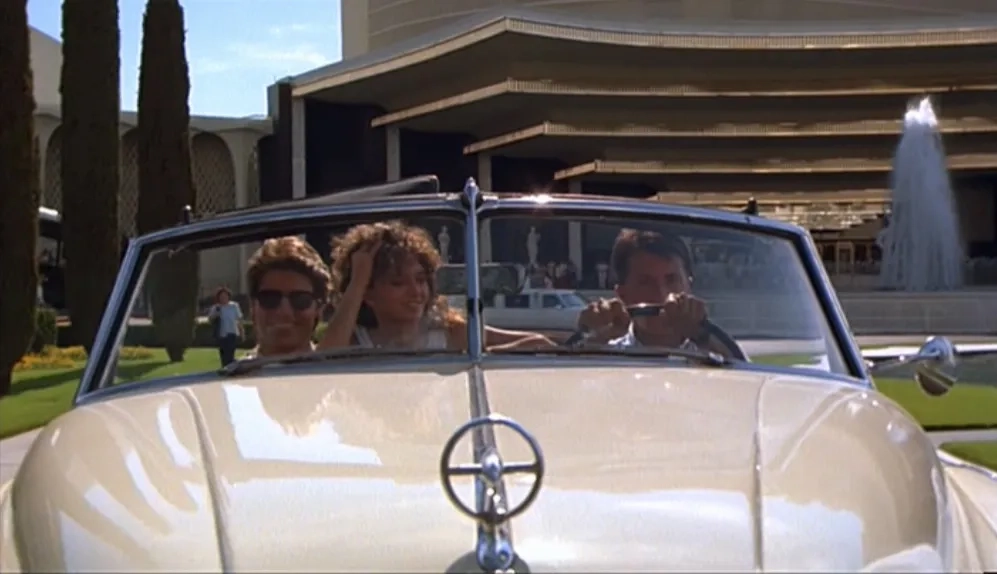 Tom Cruise, Dustin Hoffman, and Valeria Golino in Rain Man (1988)