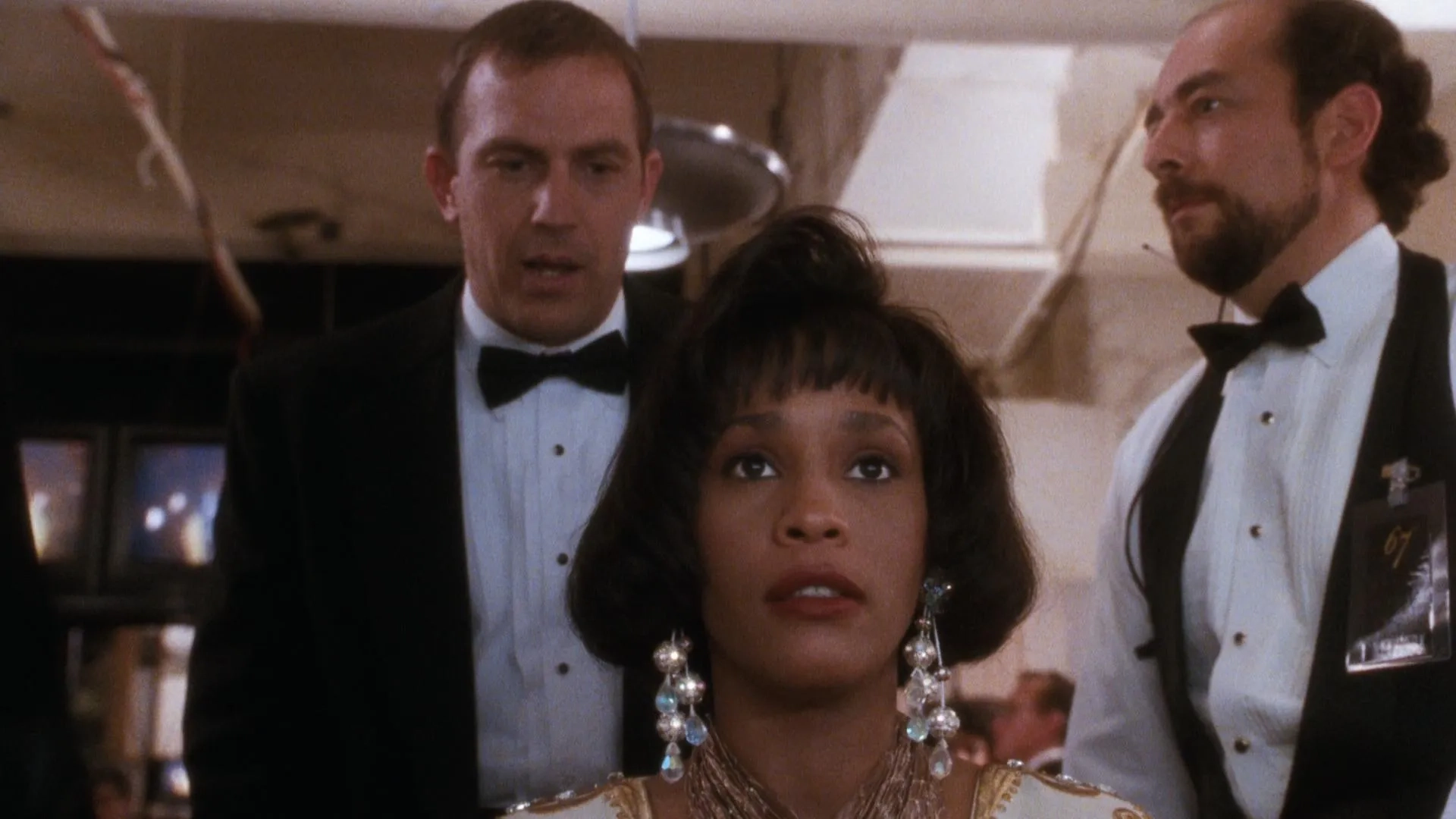 Kevin Costner, Whitney Houston, and Richard Schiff in The Bodyguard (1992)