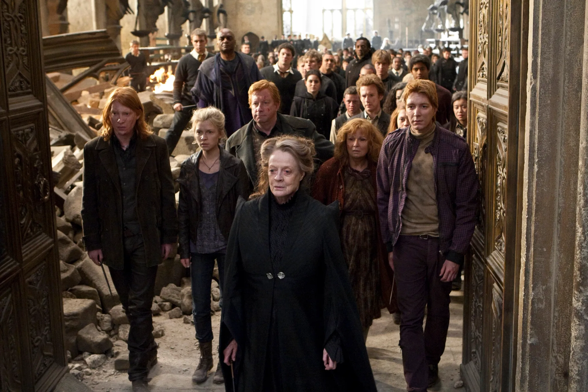 Maggie Smith, Alfred Enoch, George Harris, Devon Murray, Chris Rankin, Julie Walters, Mark Williams, Oliver Phelps, Clémence Poésy, Katie Leung, and Domhnall Gleeson in Harry Potter and the Deathly Hallows: Part 2 (2011)