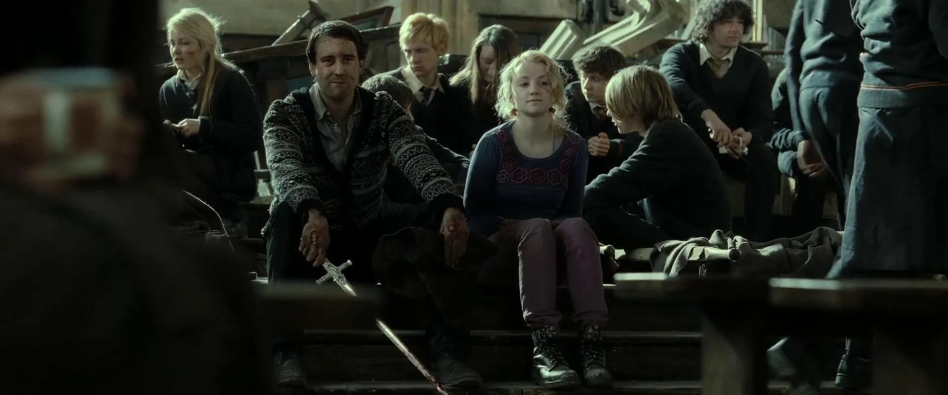 Matthew Lewis and Evanna Lynch in Harry Potter and the Deathly Hallows: Part 2 (2011)