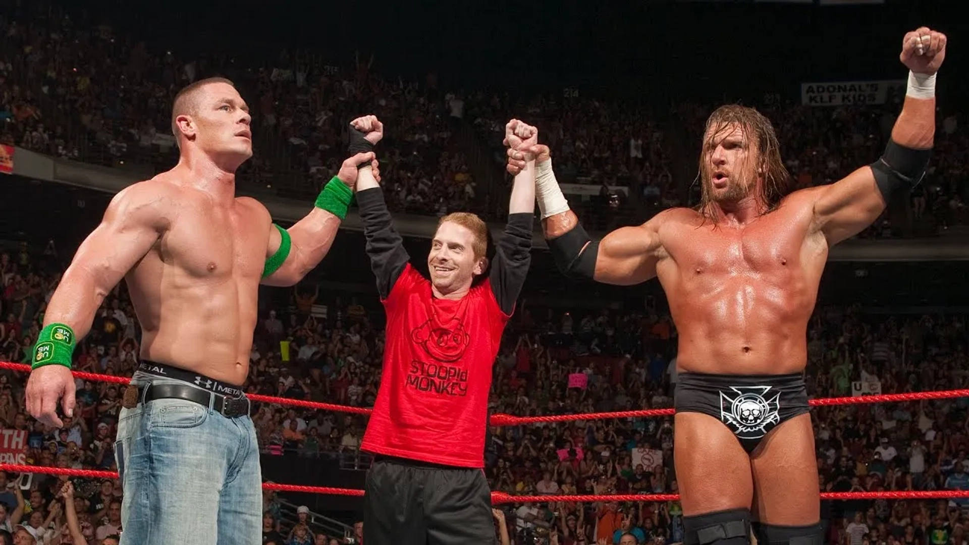 Seth Green, Paul Levesque, and John Cena in WWE Raw (1993)