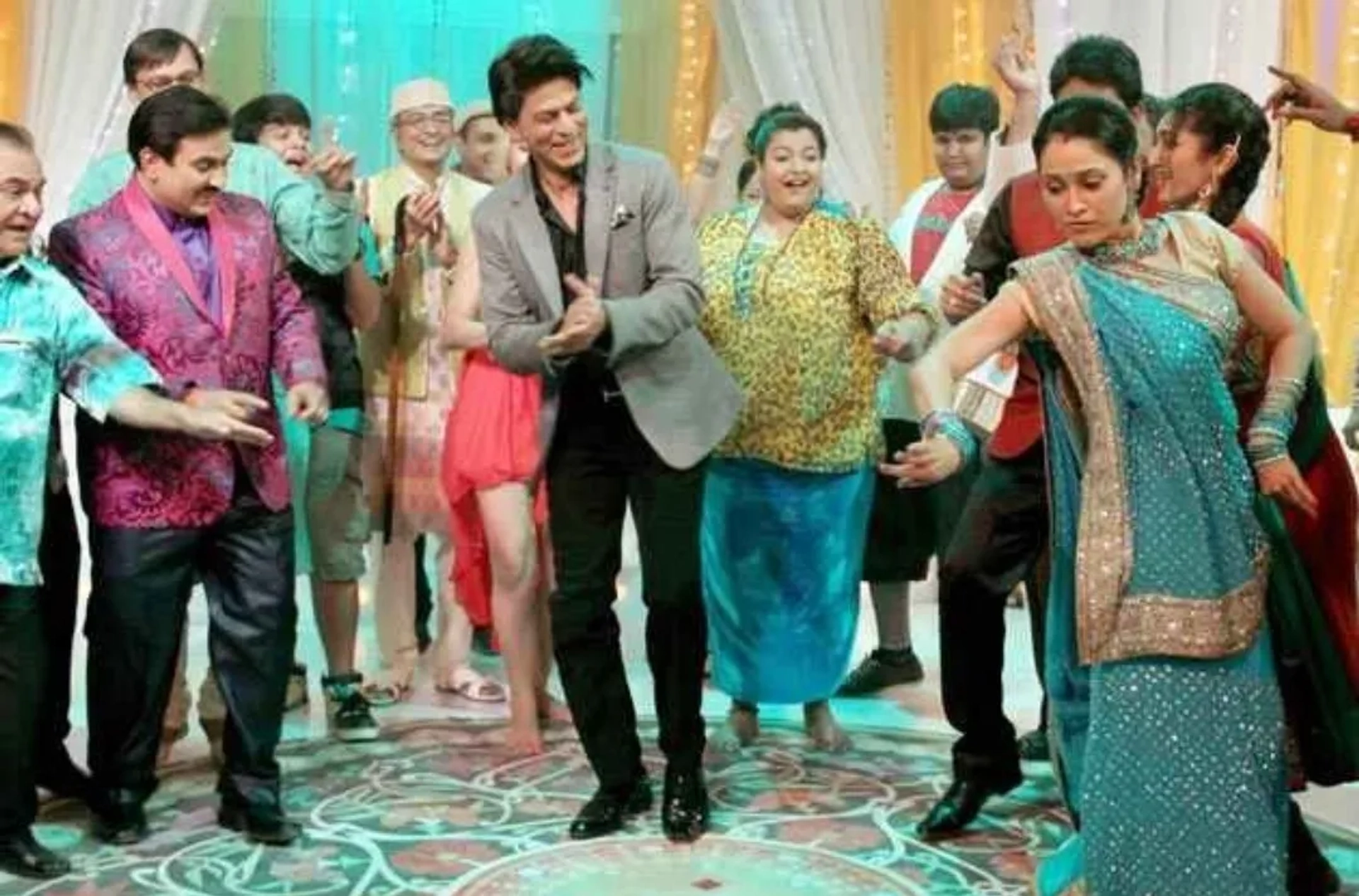 Shah Rukh Khan, Ghanshyam Nayak, Dilip Joshi, Disha Vakani, Sailesh Lodha, Amit Bhatt, Mayur Vakani, Neha Mehta, Bhavya Gandhi, Shyam Pathak, Kush Shah, and Ambika Ranjankar in Taarak Mehta Ka Ooltah Chashmah (2008)