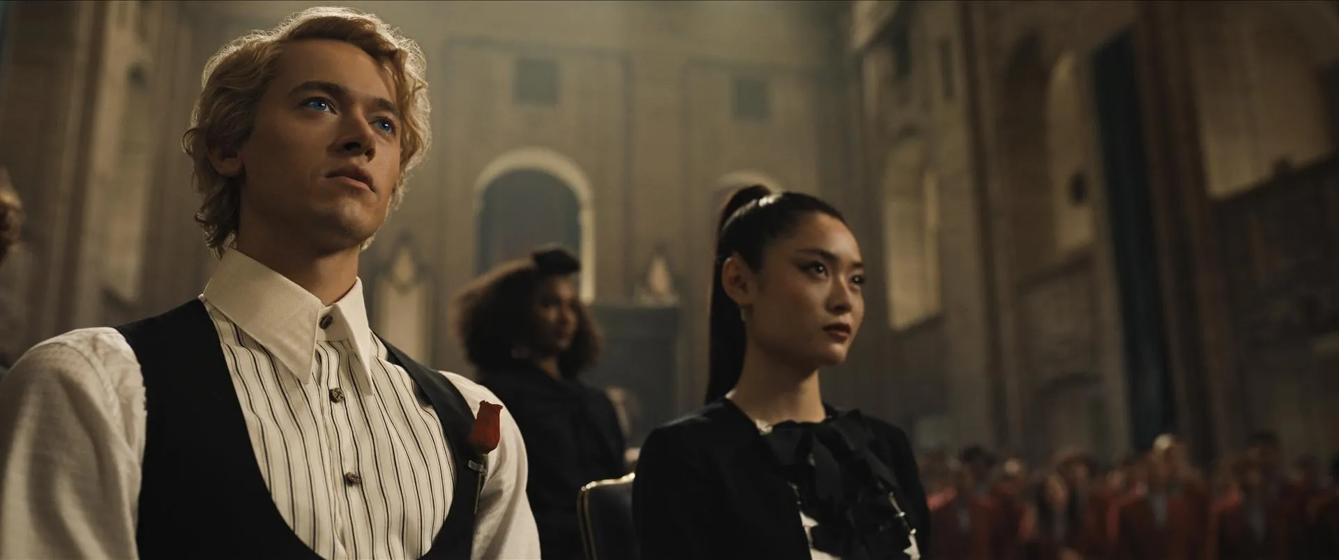 Tom Blyth, Ashley Liao, and Zoe Renee in The Hunger Games: The Ballad of Songbirds & Snakes (2023)