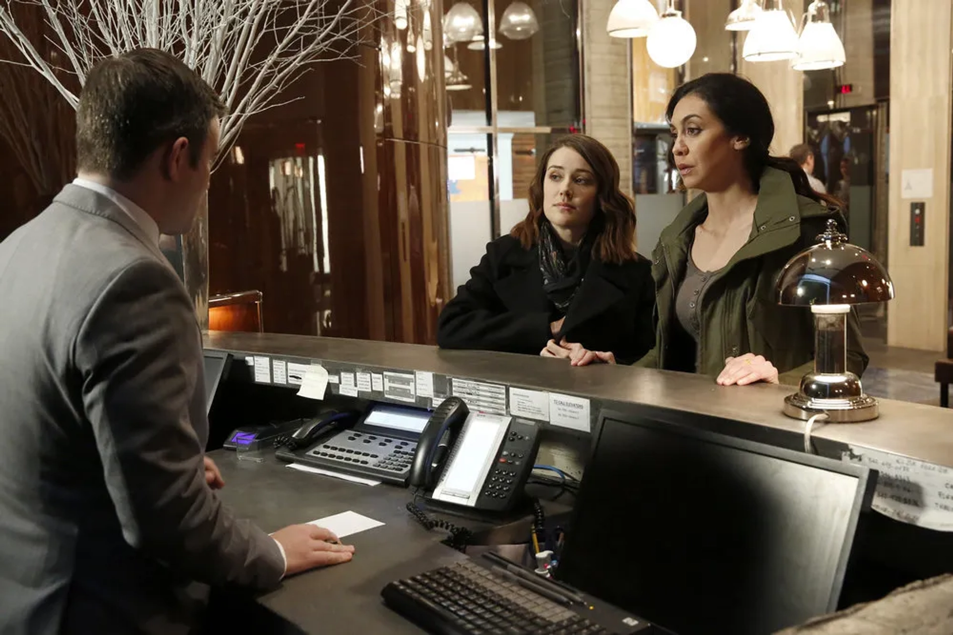 Megan Boone, Guy Olivieri, and Mozhan Marnò in The Blacklist (2013)