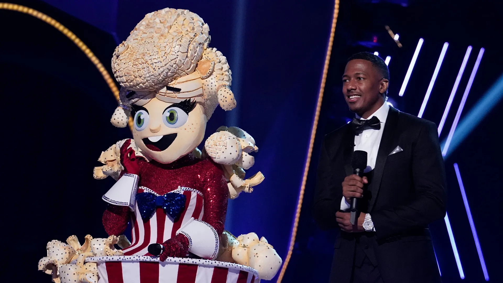 Taylor Dayne and Nick Cannon in The Masked Singer: The Season Premiere - The Masks Return (2020)