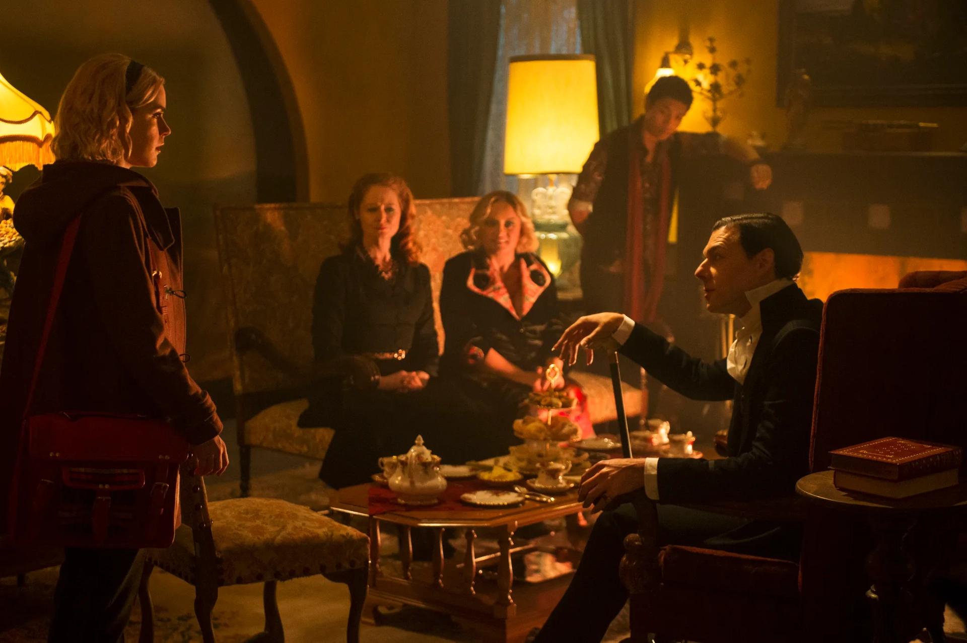 Miranda Otto, Richard Coyle, Lucy Davis, Kiernan Shipka, and Chance Perdomo in Chilling Adventures of Sabrina (2018)