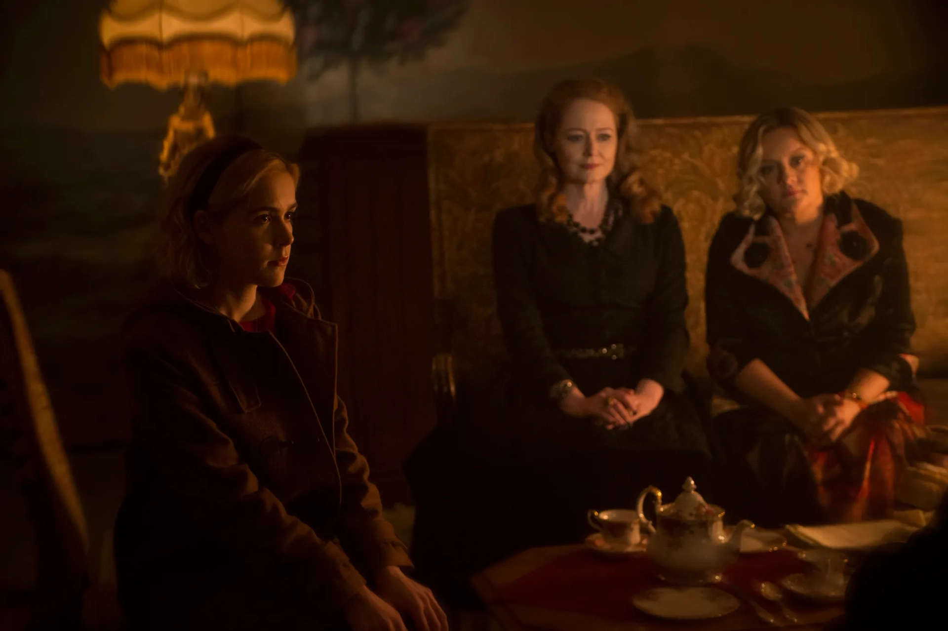 Miranda Otto, Lucy Davis, and Kiernan Shipka in Chilling Adventures of Sabrina (2018)