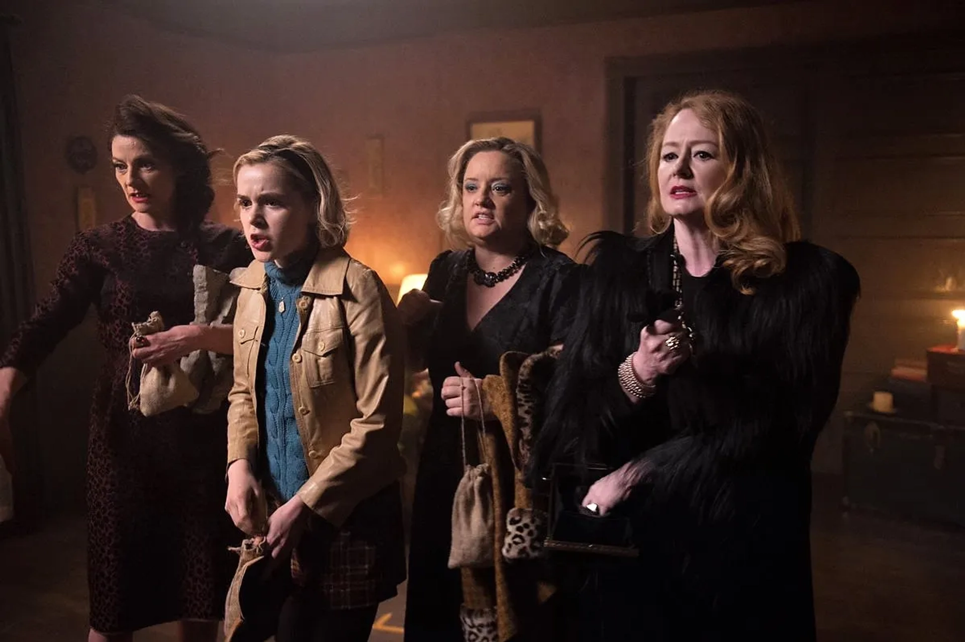 Miranda Otto, Lucy Davis, Michelle Gomez, and Kiernan Shipka in Chilling Adventures of Sabrina (2018)