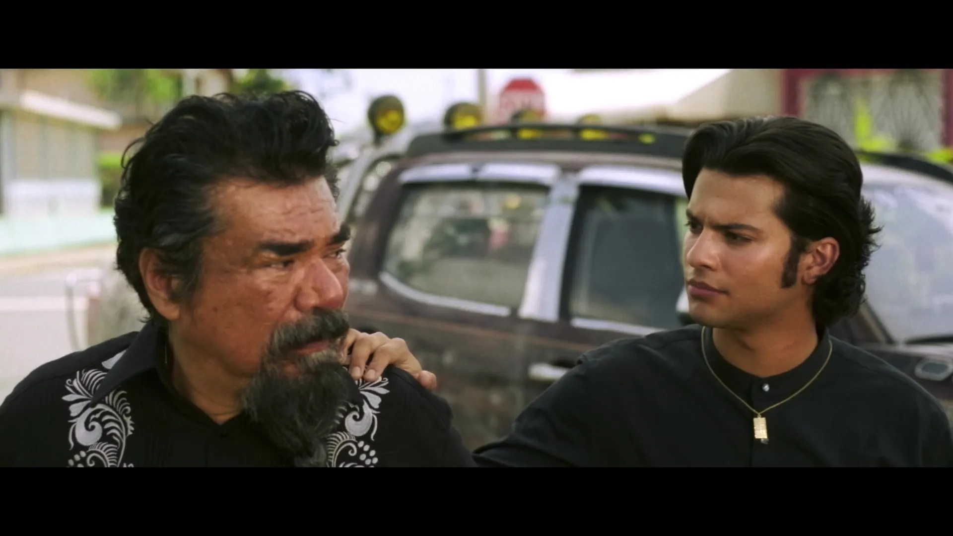 George Lopez and Xolo Maridueña in Blue Beetle (2023)