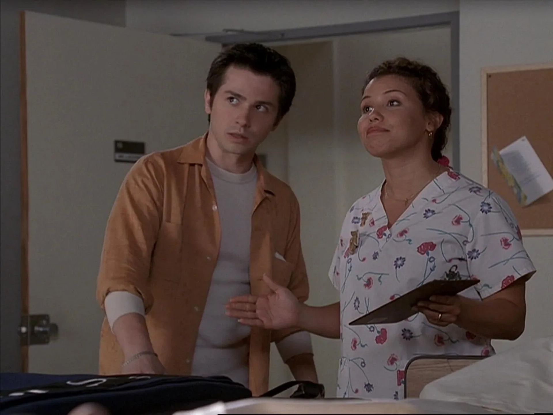 Freddy Rodríguez and Justina Machado in Six Feet Under (2001)