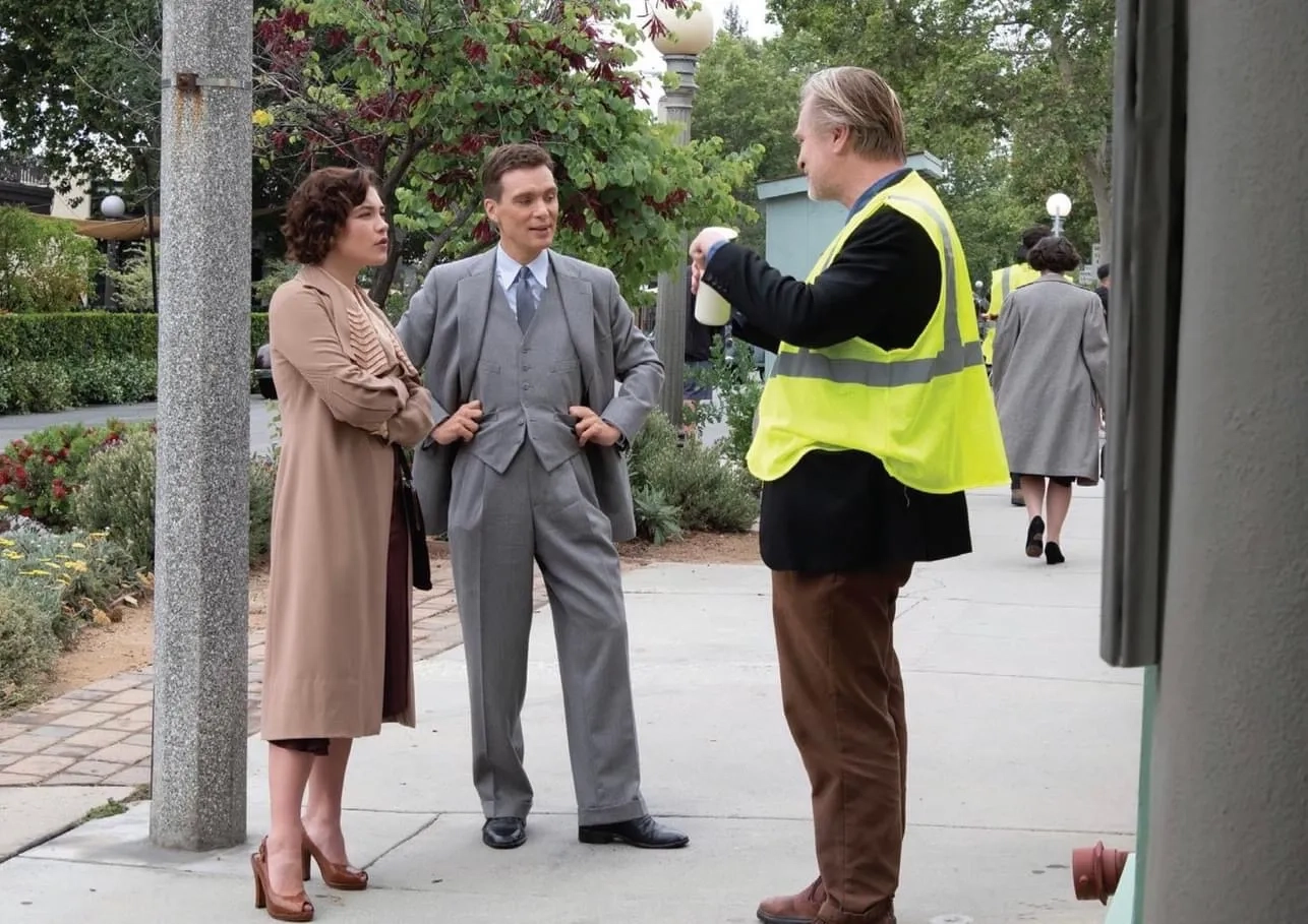 Cillian Murphy, Christopher Nolan, and Florence Pugh in Oppenheimer (2023)