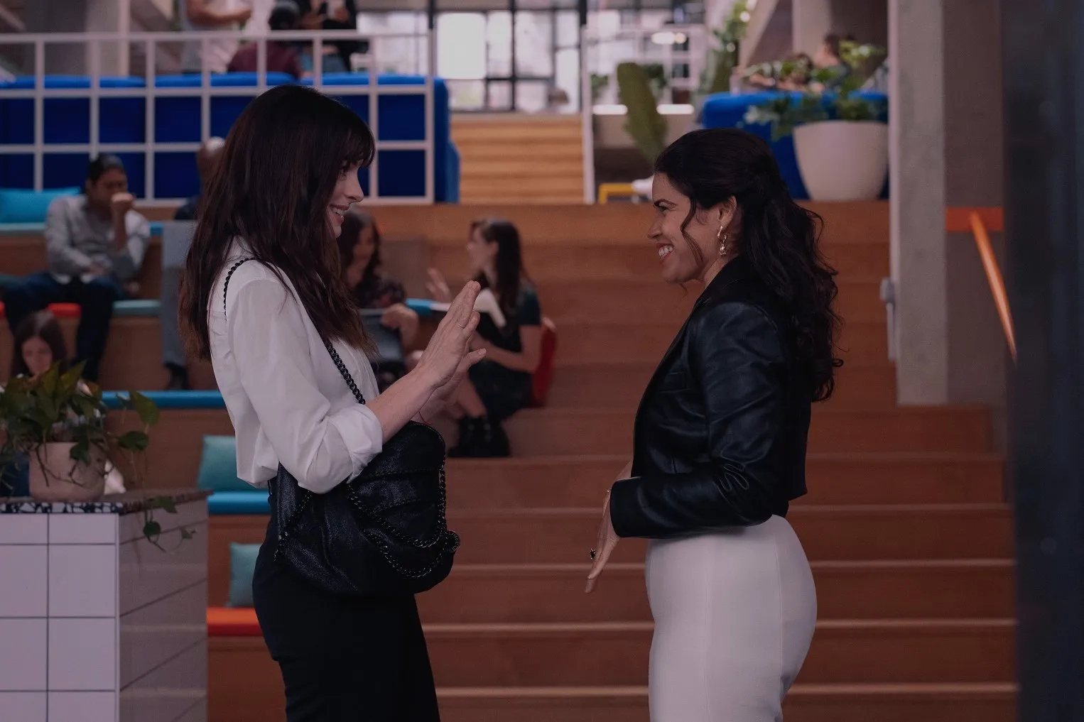 Anne Hathaway and America Ferrera in WeCrashed (2022)
