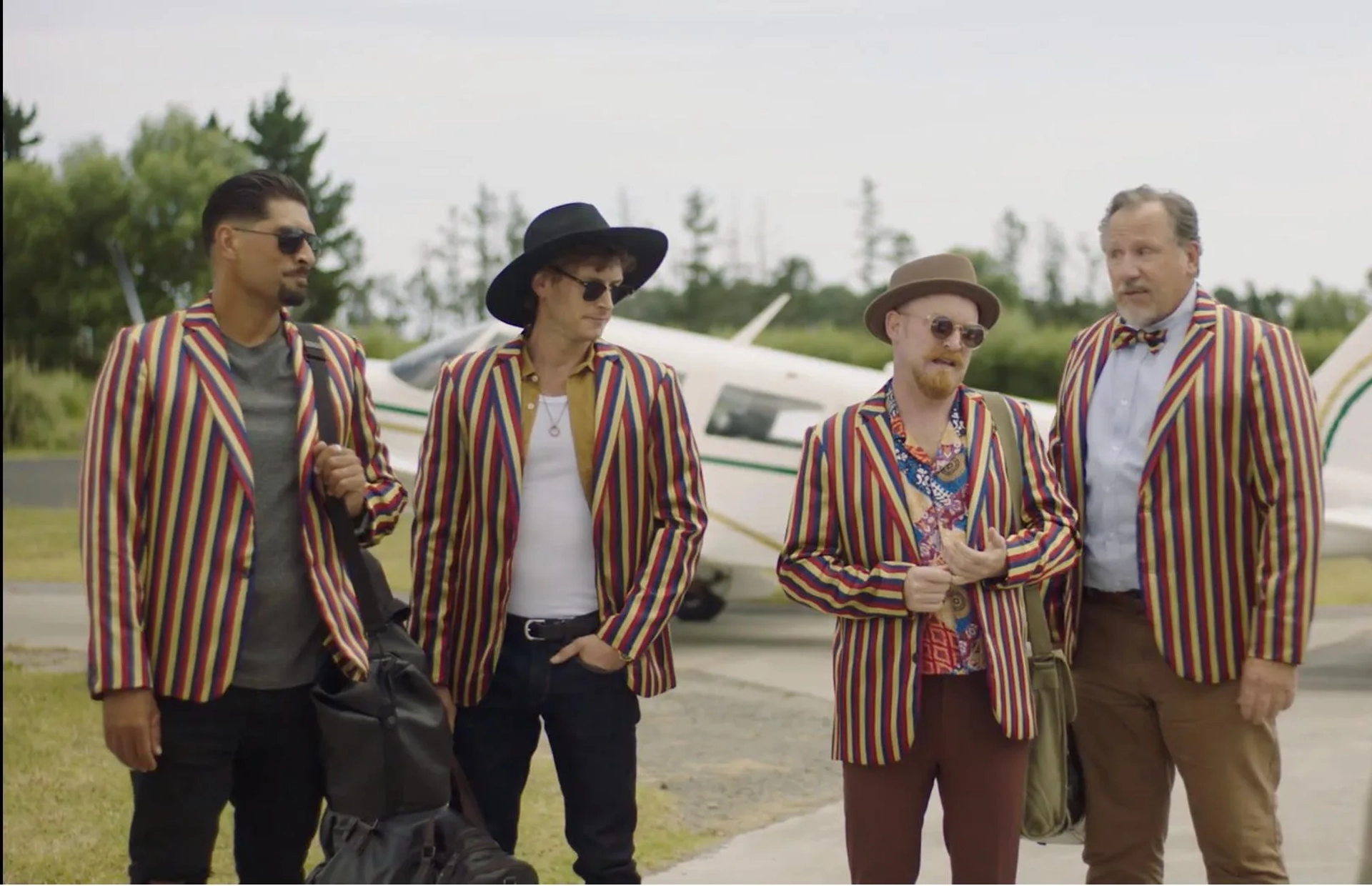 Andrew Grainger, Te Kohe Tuhaka, Jordan Mooney, and Byron Coll in The Brokenwood Mysteries: Three Coins in a Fountain (2022)