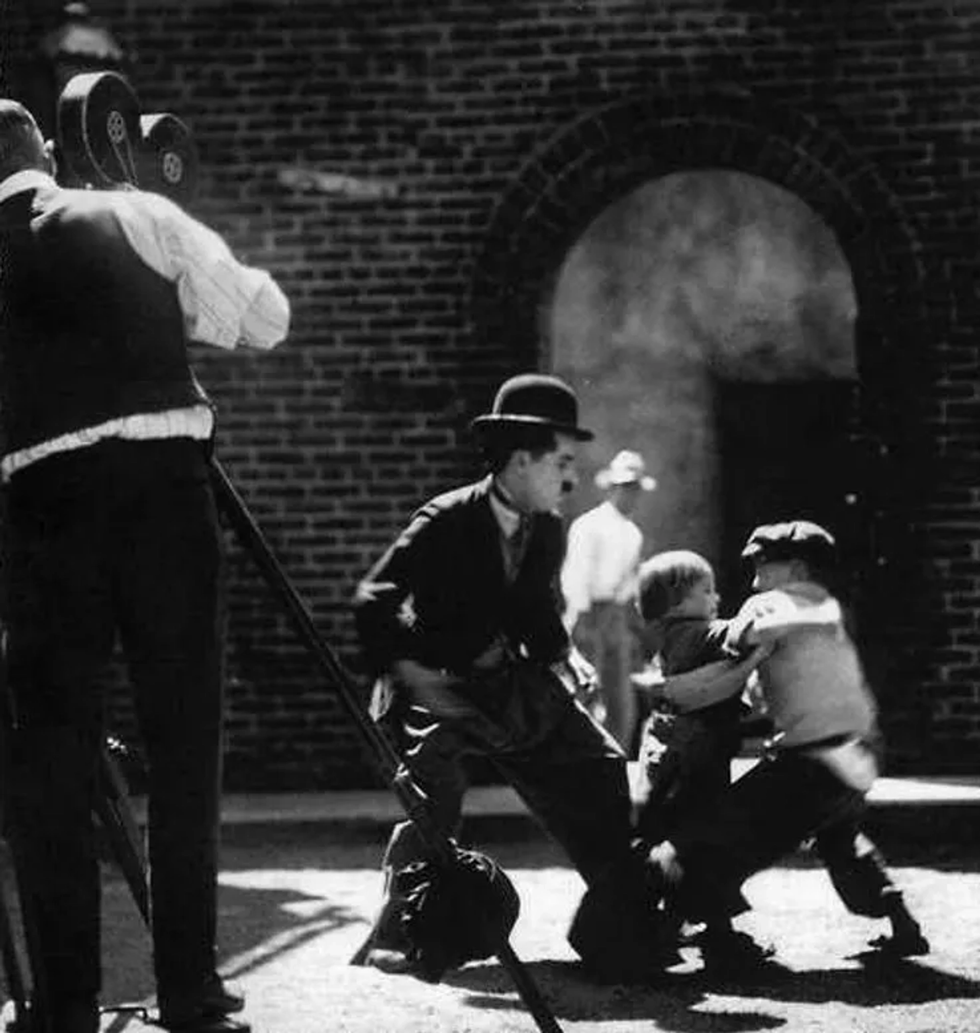 Charles Chaplin, Jackie Coogan, and Raymond Lee in The Kid (1921)