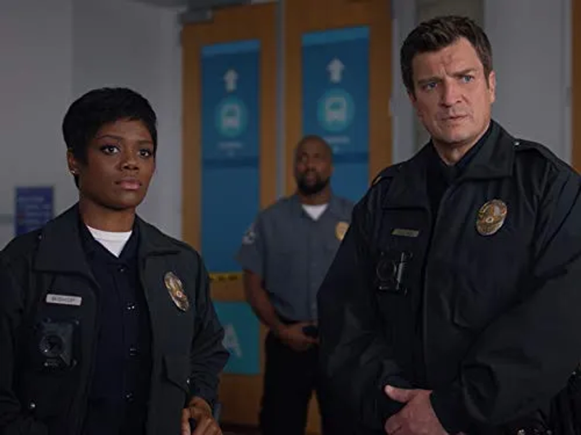 Nathan Fillion and Afton Williamson in The Rookie (2018)