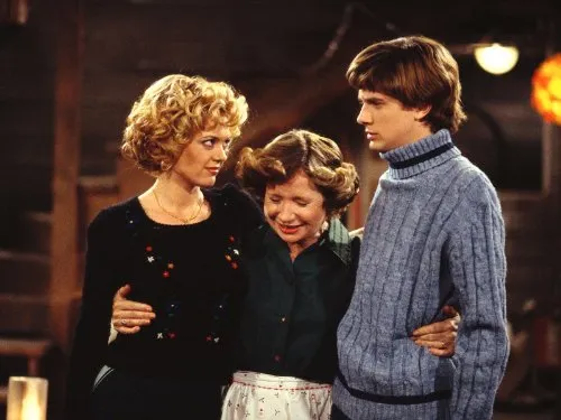 Topher Grace, Lisa Robin Kelly, and Debra Jo Rupp in That '70s Show (1998)